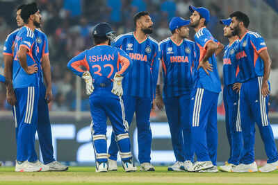 ahmedabad feb 18 ani india39s varun chakaravarthy with his teammates celebra