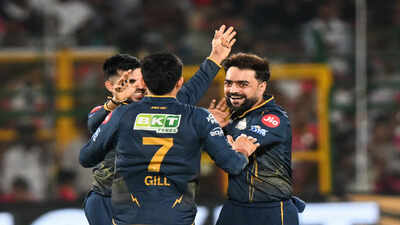 jaipur may 09 ani gujarat titans39 rashid khan and teammates celebrate the wi