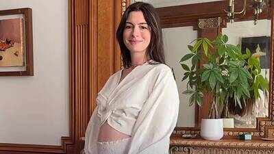 anne hathaway says she was shocked to learn she was pregnant with baby no 3 were calling this one our buzzer beater