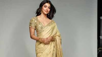pooja hegde serves timeless ethnic elegance in a beige gold tissue silk saree worth rs 191 lakh image credits instagram