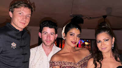 priyanka chopra wears embroidered indian outfit with floral gajra as nick jonas matches in cream and white at star studded diwali gathering in la